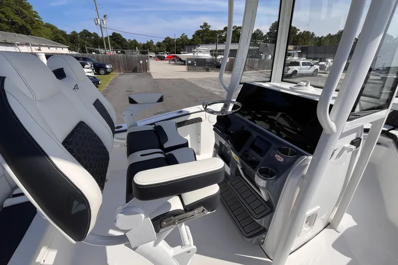 Slide: The Image of 2027 Tidewater 210 LXF boat interior with modern helm and seating. - 13