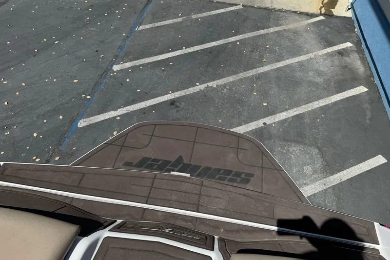 Slide: The Image of 2019 Sanger 212 SL boat in parking lot, viewed from above. - 12