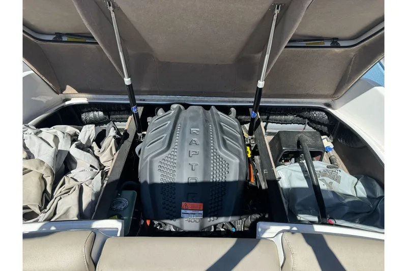 Slide: The Image of Open engine compartment of 2019 Sanger 212 SL boat, featuring Raptor engine. - 23