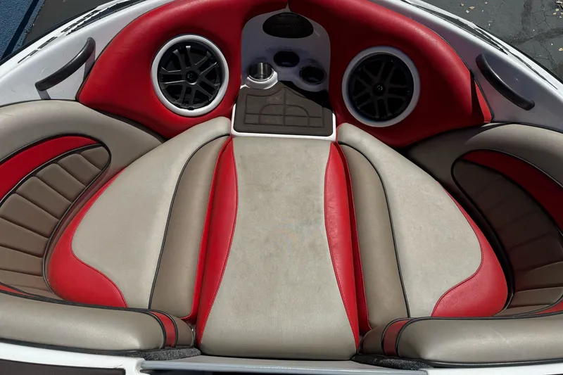 Slide: The Image of Interior of 2019 Sanger 212 SL boat with red and beige seating. - 19