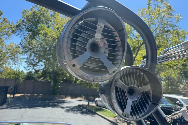 Slide: The Image of Outdoor speakers on a 2019 Sanger 212 SL boat, mounted on a metal frame. - 26