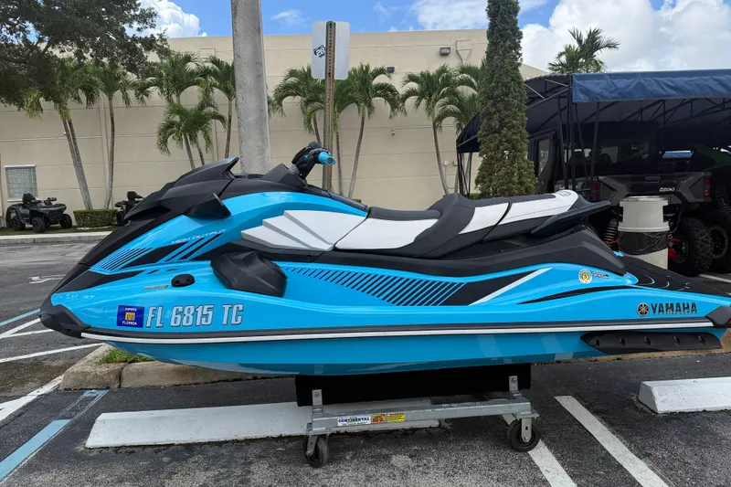 Slide: The Image of 2022 Yamaha WaveRunner GP1800R in vibrant blue, parked outdoors. - 10