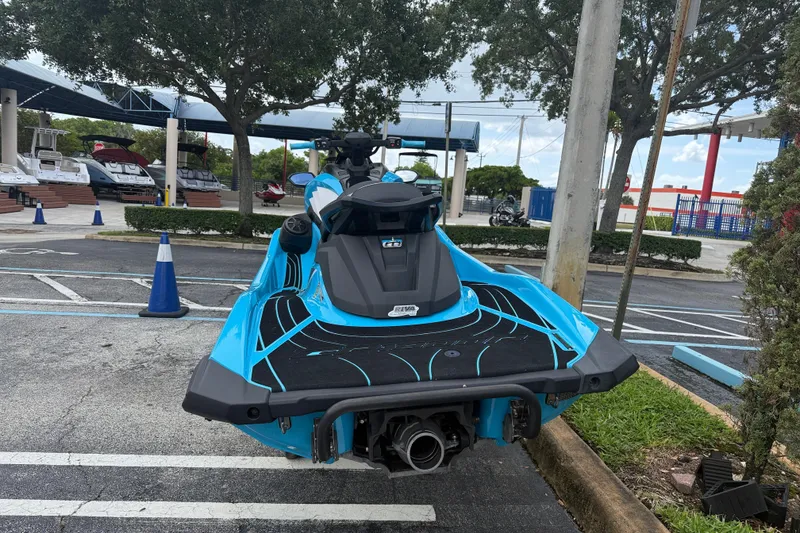 Slide: The Image of 2022 Yamaha WaveRunner GP1800R in a parking lot, showcasing its sleek blue design. - 15