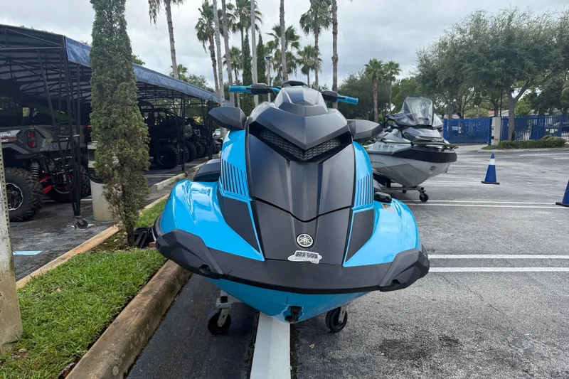 Slide: The Image of 2022 Yamaha WaveRunner GP1800R in a parking lot, showcasing sleek design and vibrant blue color. - 12