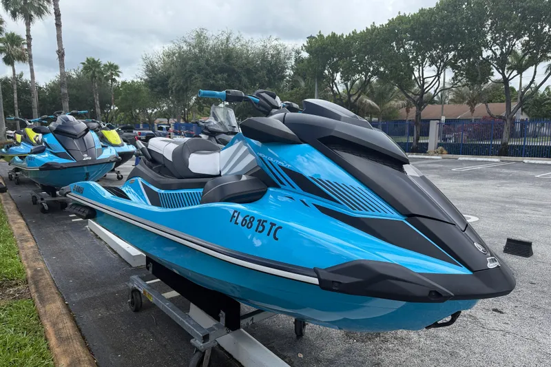 Slide: The Image of 2022 Yamaha WaveRunner GP1800R in blue, parked outdoors on a trailer. - 13
