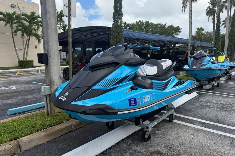 Slide: The Image of 2022 Yamaha WaveRunner GP1800R in blue, parked outdoors on a trailer. - 11