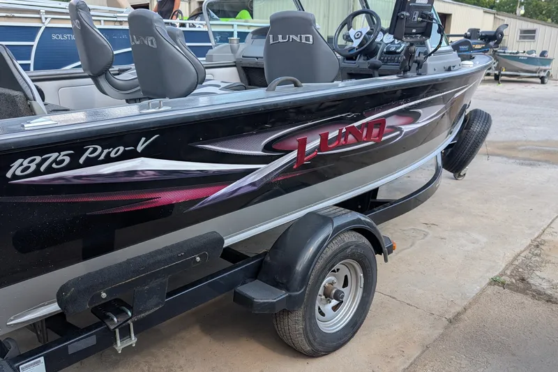 Slide: The Image of 2012 Lund 1875 Pro-V IFS fishing boat on trailer, side view. - 3