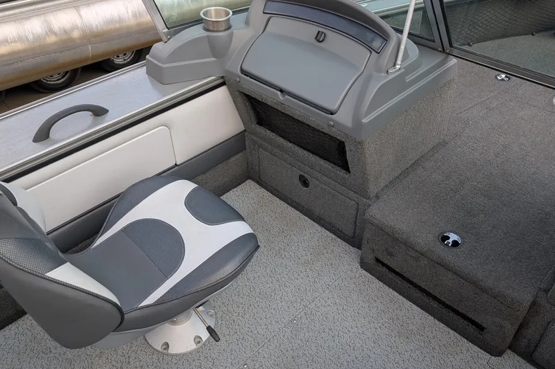 Slide: The Image of Interior of a 2012 Lund 1875 Pro-V IFS boat with seating and storage. - 6