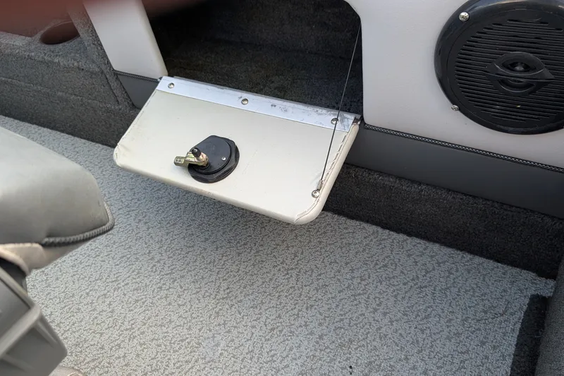 Slide: The Image of Interior of 2012 Lund 1875 Pro-V IFS boat showing speaker and storage compartment. - 18