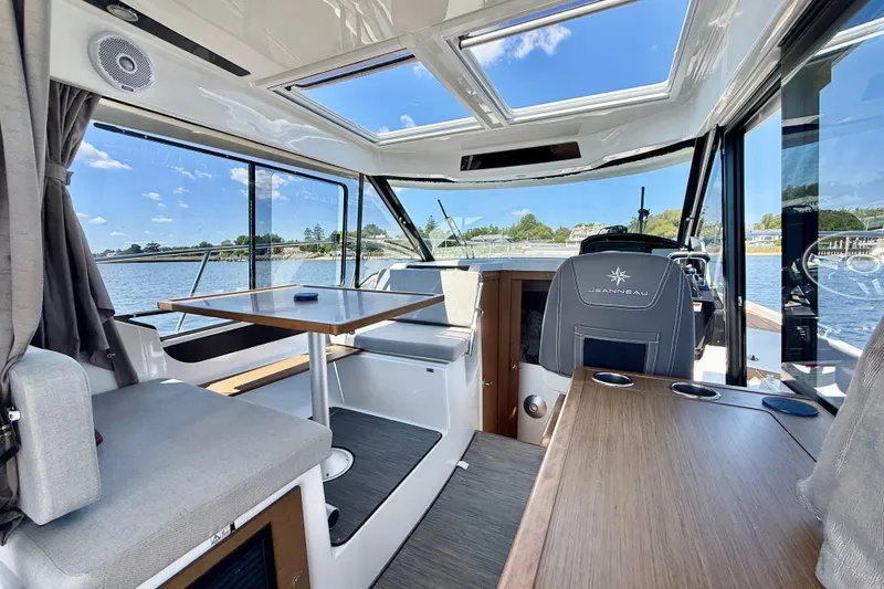 Slide: The Image of Interior of 2019 Jeanneau NC 895 boat with seating and panoramic windows. - 12