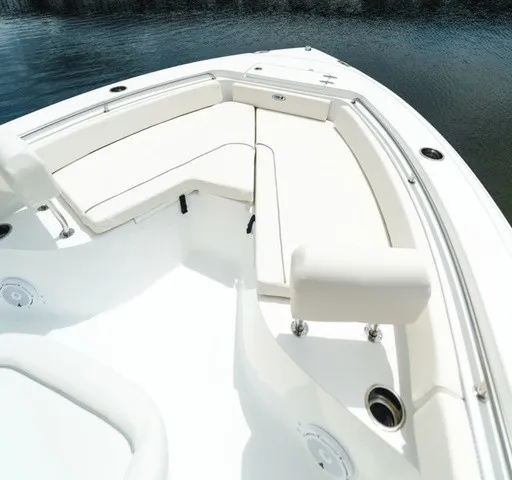 Slide: The Image of The image shows the bow area of a Sea Hunt Ultra 229 boat with white cushions. - 9