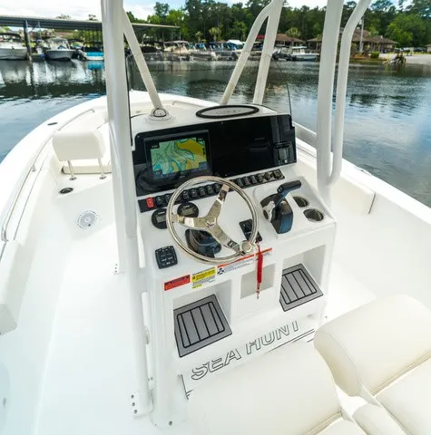 Slide: The Image of Helm of the Sea Hunt Ultra 229 with modern navigation system and comfortable seating. - 6