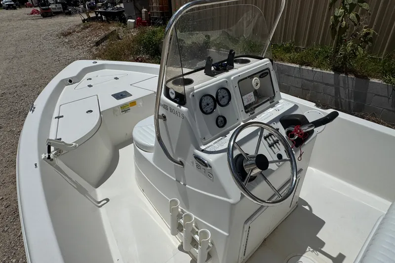 Slide: The Image of 2009 NauticStar 1810 NauticBay boat interior with steering console and seating. - 9