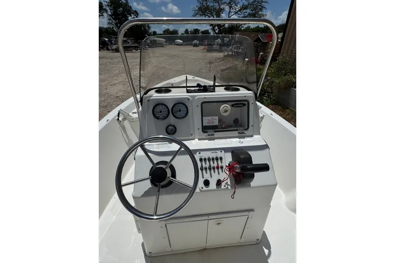 Slide: The Image of 2009 NauticStar 1810 NauticBay boat console with steering wheel and control panel. - 7