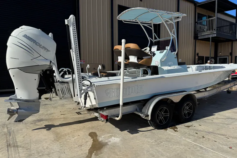 Slide: The Image of 2021 Haynie 25 Magnum boat with Mercury Verado engine on a trailer. - 19