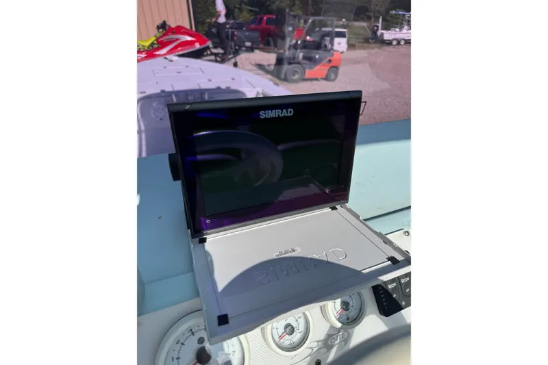 Slide: The Image of Simrad display on 2021 Haynie 25 Magnum boat dashboard with gauges and controls. - 12