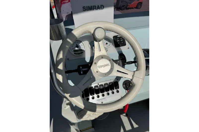 Slide: The Image of Steering wheel of 2021 Haynie 25 Magnum boat with Simrad electronics. - 8