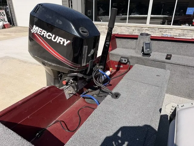 Slide: The Image of A 2009 Lund 1625 REBEL XL with a Mercury outboard motor and a fish finder in the stern area. - 5