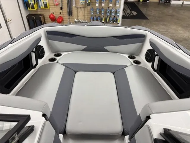 Slide: The Image of The image shows the bow area of a 2027 Axis Wake Research A245 boat with gray upholstery. - 5