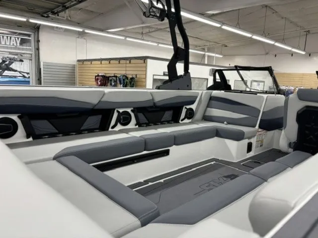 Slide: The Image of Interior view of a modern boat with gray and white seating, speakers, and an open design. - 10