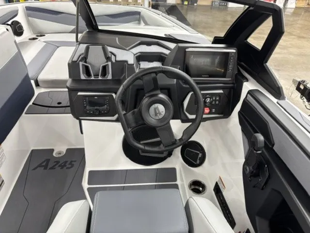 Slide: The Image of The cockpit of the 2027 Axis Wake Research A245 features a modern steering wheel and digital display. - 7