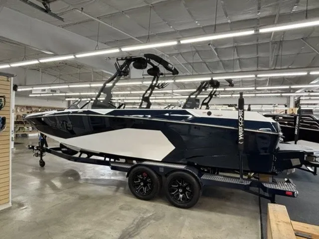 The Image of A 2027 Axis Wake Research A245 on a trailer in a showroom. - 1