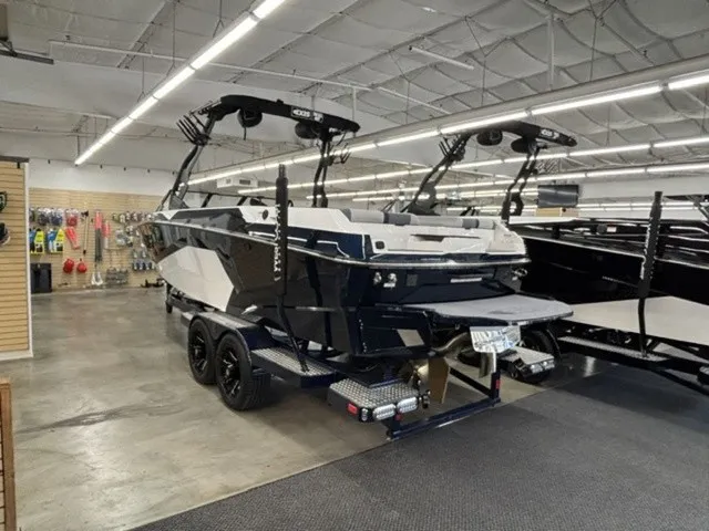Slide: The Image of 2027 Axis Wake Research A245 displayed in a showroom. - 2