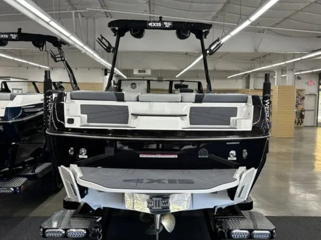 Slide: The Image of Rear view of a 2027 Axis Wake Research T250 in a showroom. - 5