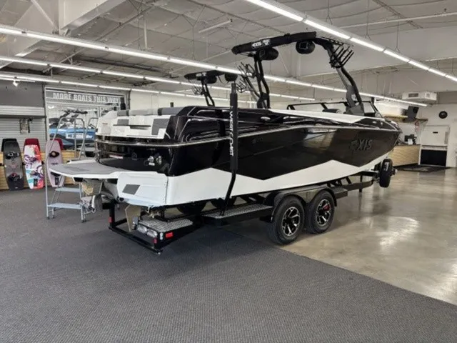 Slide: The Image of 2027 Axis Wake Research T250 in a showroom. - 2