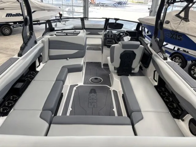 Slide: The Image of Interior view of an Axis Wake Research A225 boat with gray and white seating. - 6
