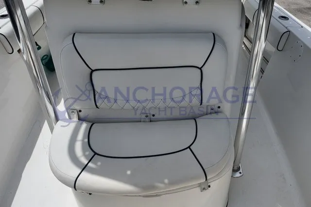 Slide: The Image of White cushioned bench with black stitching on a boat. - 4