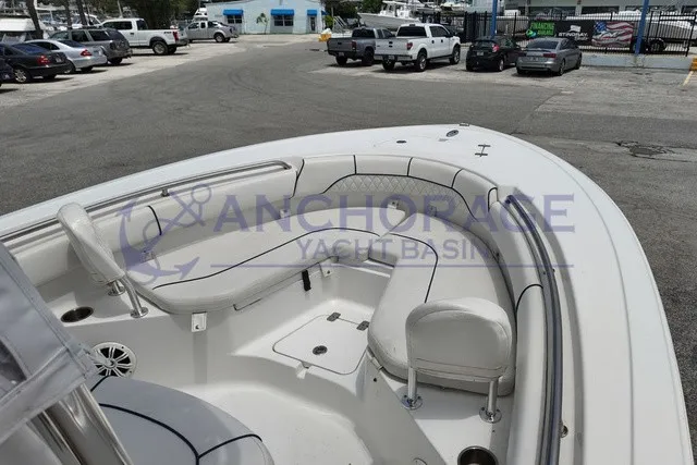 Slide: The Image of The image shows the bow area of a 2013 Sportsman Heritage 211 Center Console boat. - 2