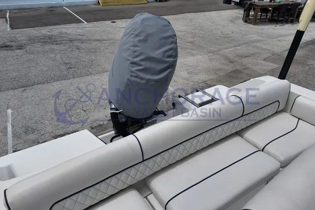 Slide: The Image of The image shows the cushioned stern of a 2013 Sportsman Heritage 211 Center Console boat. - 8