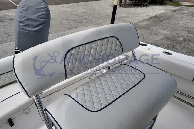 Slide: The Image of The 2013 Sportsman Heritage 211 Center Console features a cushioned bench seat with a quilted pattern. - 6