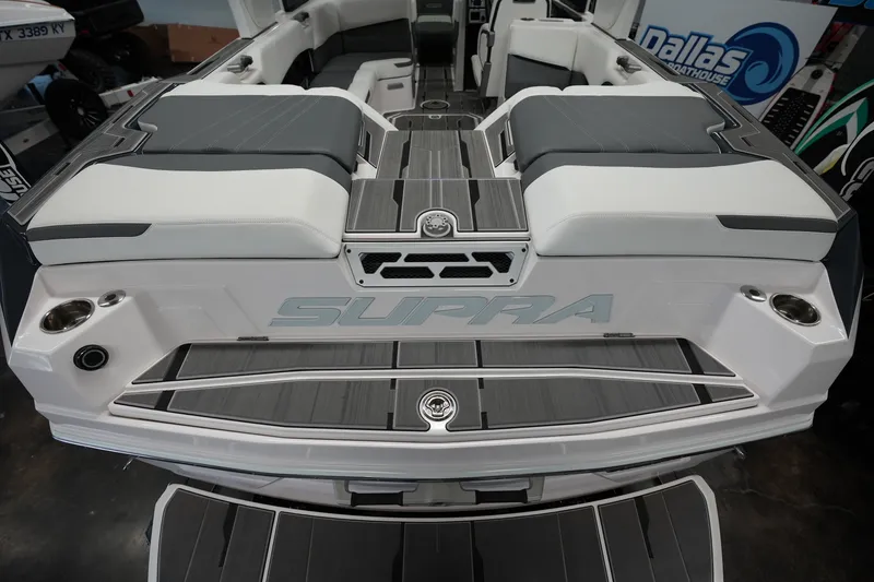 Slide: The Image of 2023 Supra SA 450 boat interior with sleek seating and modern design. - 11