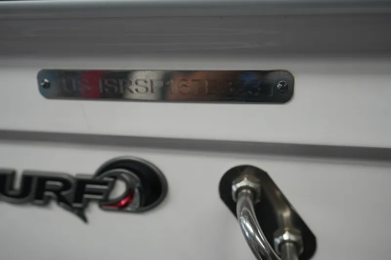 Slide: The Image of 2023 Supra SA 450 boat detail with metal plate and surf logo. - 25