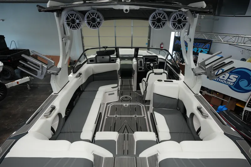 Slide: The Image of 2023 Supra SA 450 boat interior with modern seating and audio system. - 13