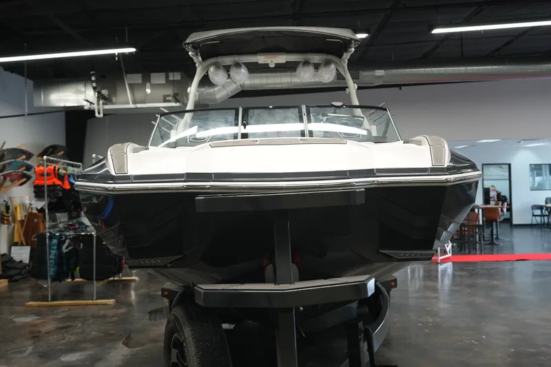 Slide: The Image of 2023 Supra SA 450 boat displayed indoors, showcasing sleek design and modern features. - 9