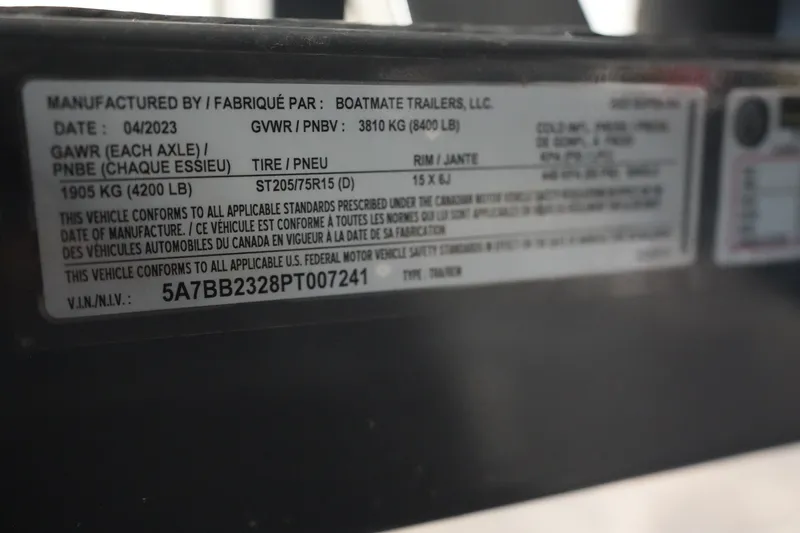 Slide: The Image of Label on a 2023 Supra SA 450 trailer, detailing specifications and compliance information. - 26