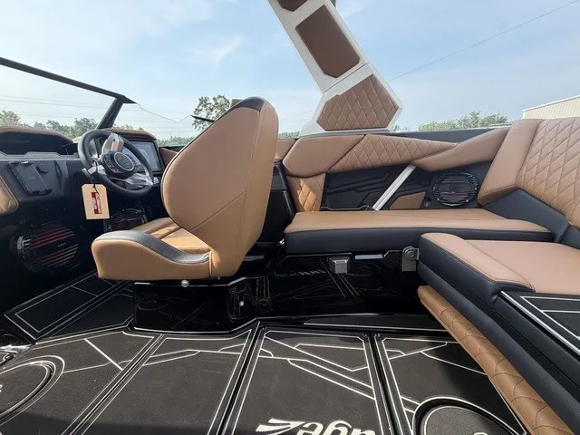 Slide: The Image of The interior of a 2027 Tigé Z1 with brown leather seats and modern design. - 16
