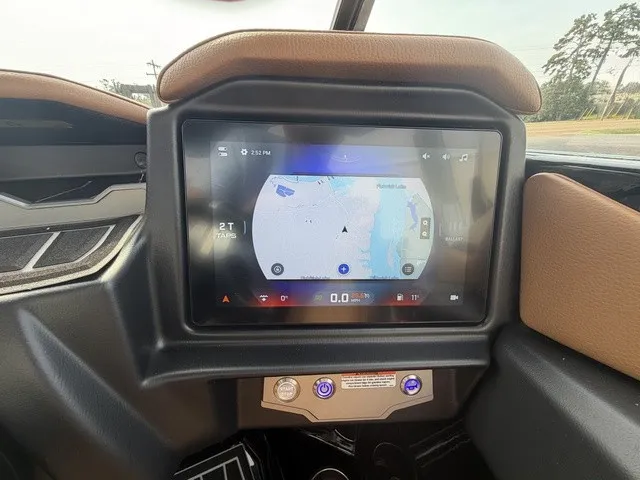 Slide: The Image of The image shows the dashboard of a Tigé Z1 boat with a modern navigation system. - 14