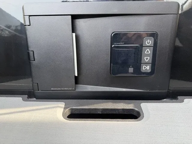 Slide: The Image of Close-up of a control panel on a boat with various buttons and a display. - 23