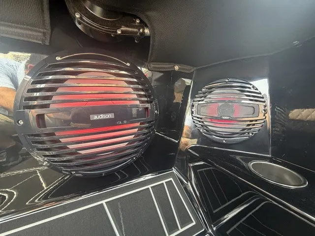 Slide: The Image of Close-up of speakers in a modern boat, surrounded by glossy black surfaces. - 15