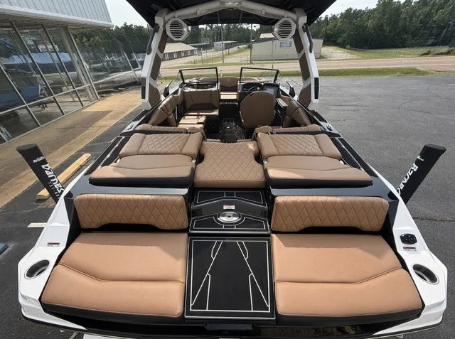 Slide: The Image of The image shows a luxurious boat with brown upholstery and modern speakers. - 19