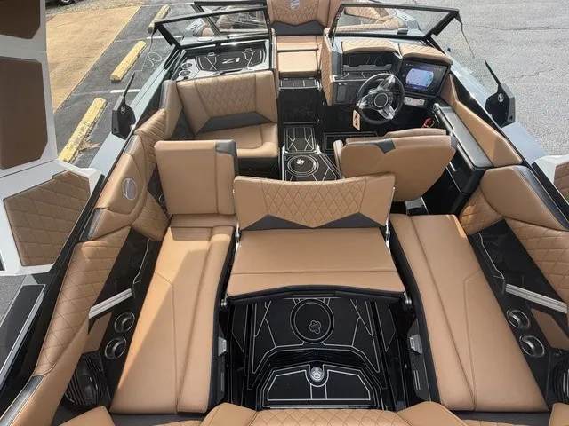 Slide: The Image of The image shows the interior of a 2027 Tigé Z1 boat with luxurious brown leather seating. - 20