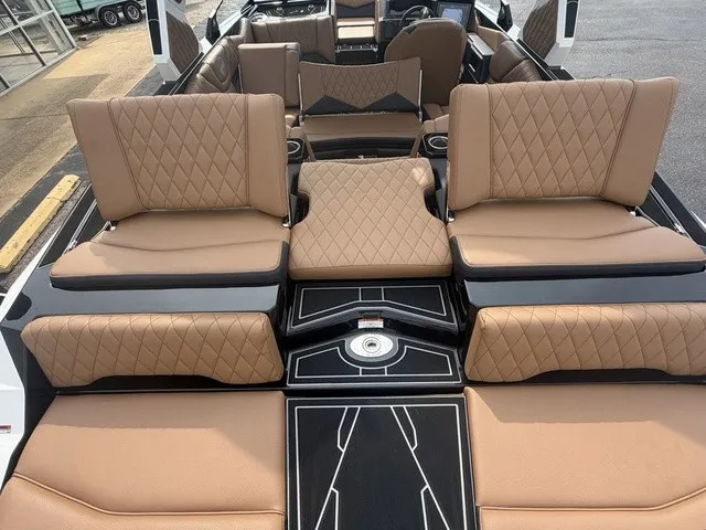 Slide: The Image of The image shows the luxurious interior of a Tigé Z1 boat with elegant brown upholstered seats. - 21