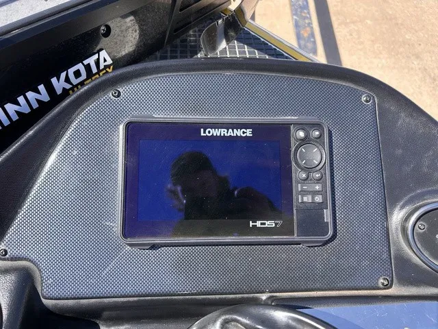 Slide: The Image of A Lowrance HDS-7 fishfinder is integrated into a boat's dashboard. - 18