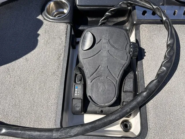 Slide: The Image of Close-up of a control device on a 2015 Triton 20 TrX boat. - 19