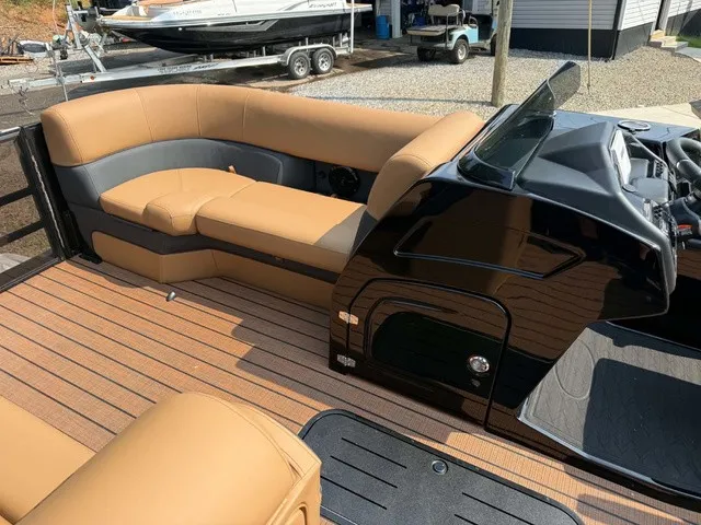 Slide: The Image of The image shows the cockpit of a 2027 Bentley Pontoons Elite 223 Admiral with sleek seating. - 9