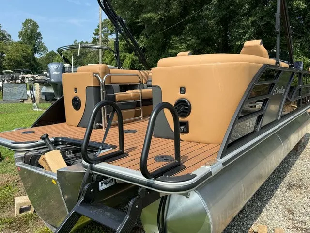 Slide: The Image of The image shows a Bentley Pontoons Elite 223 Admiral pontoon boat with sleek seating and modern design. - 11